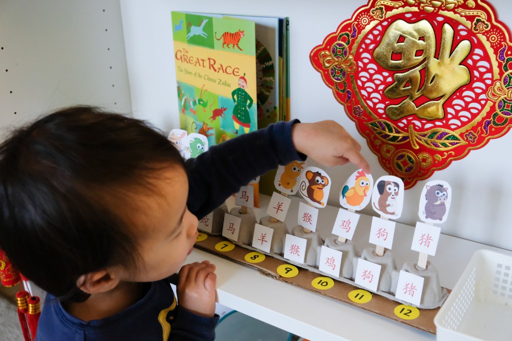 Children new year game with chinese zodiac animals